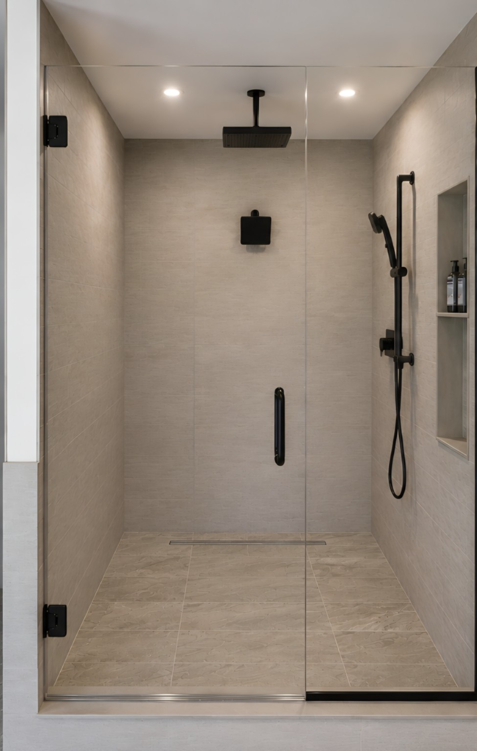Walk-in shower with frameless glass and matte black fixtures